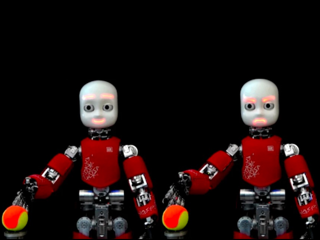 Dos robots que tenen la boca il•luminada per mostrar alegria o enuig